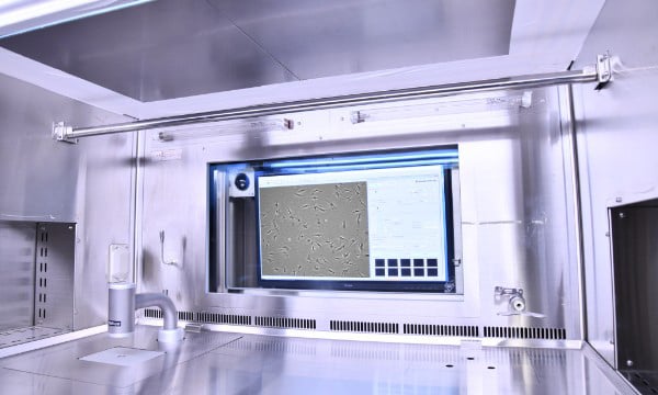 Example biosafety cabinet setup. The device is compact and mounted flush with the workbench so it does not take up space or obstruct the user’s work.